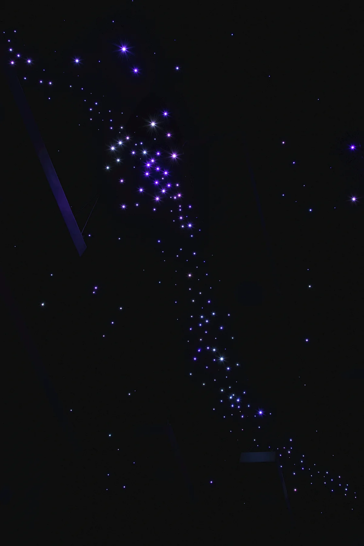 Constellations drawn on the ceiling in points of light, from optical fibres.