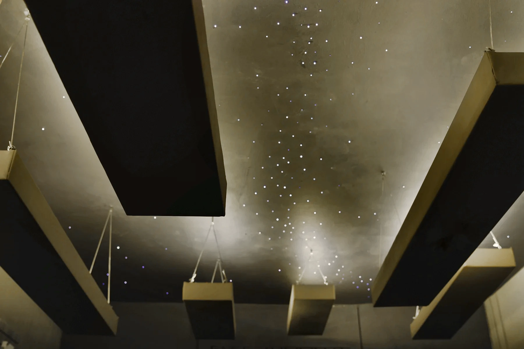 The same ceiling from the other side, stars scattered between the panels.