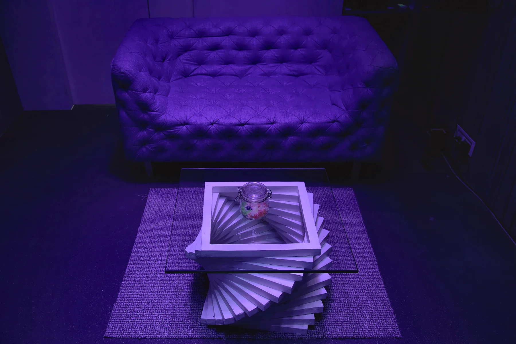 Aesthetics: A sound experience shop designed to feel like a home: a wall of reclaimed wood that absorbs sound, a ceiling of stars in optical fibre, and furniture made to move on.